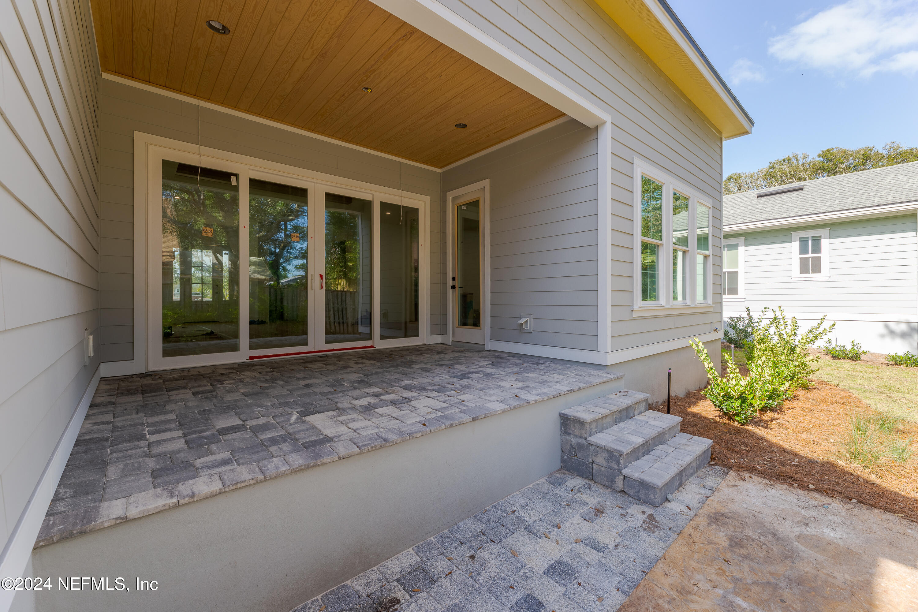 372 Ridgeway Road St. Augustine, FL 32080 - Photo 13 of 38 a view of a house with potted plants