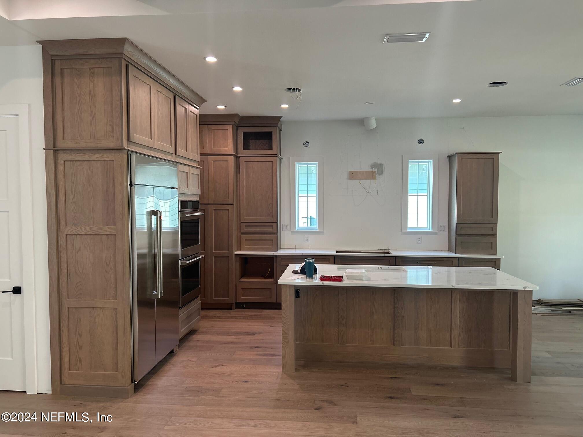 372 Ridgeway Road St. Augustine, FL 32080 - Photo 20 of 38 a large kitchen with stainless steel appliances granite countertop a refrigerator and a sink