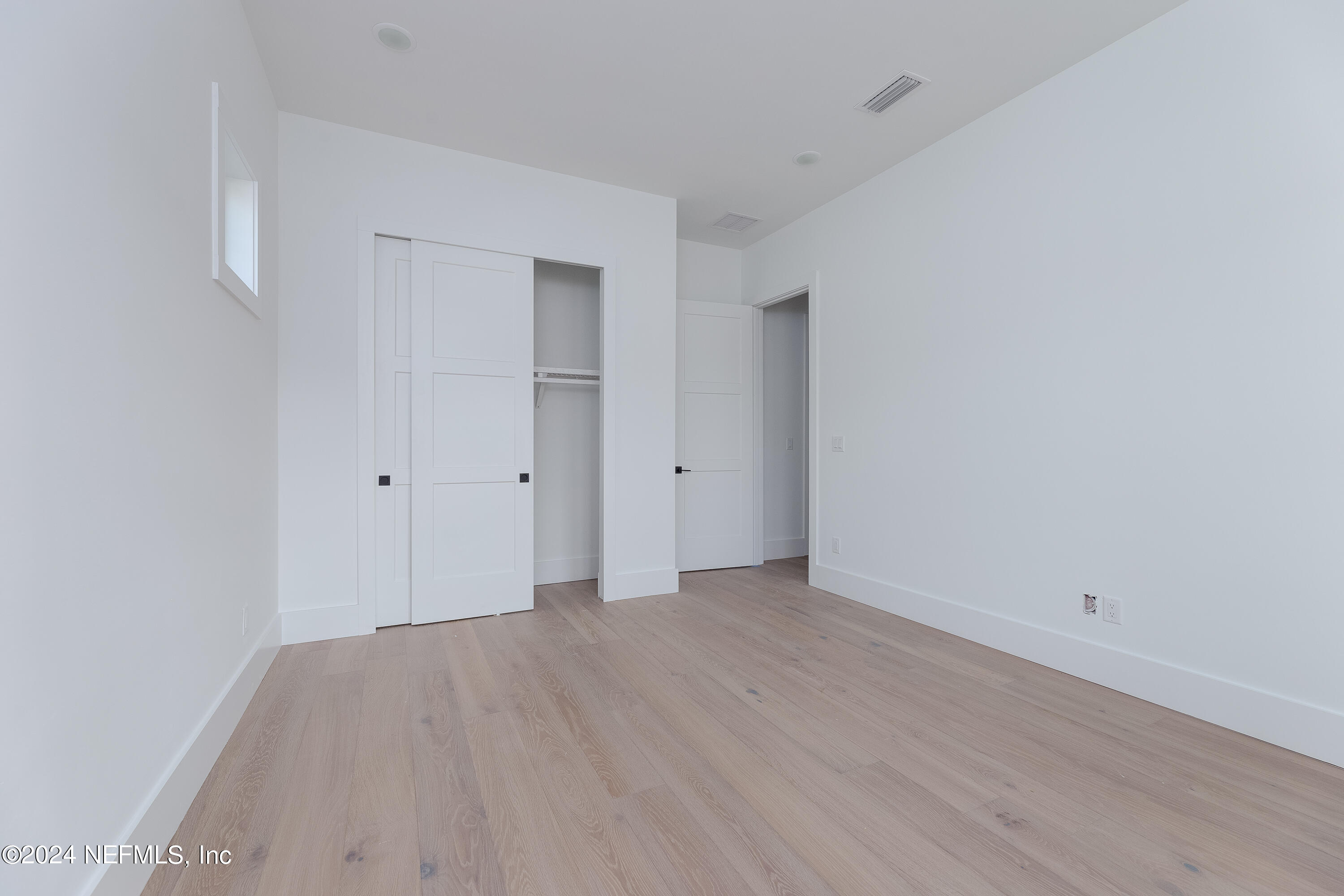 372 Ridgeway Road St. Augustine, FL 32080 - Photo 31 of 38 a view of an empty room with wooden floor