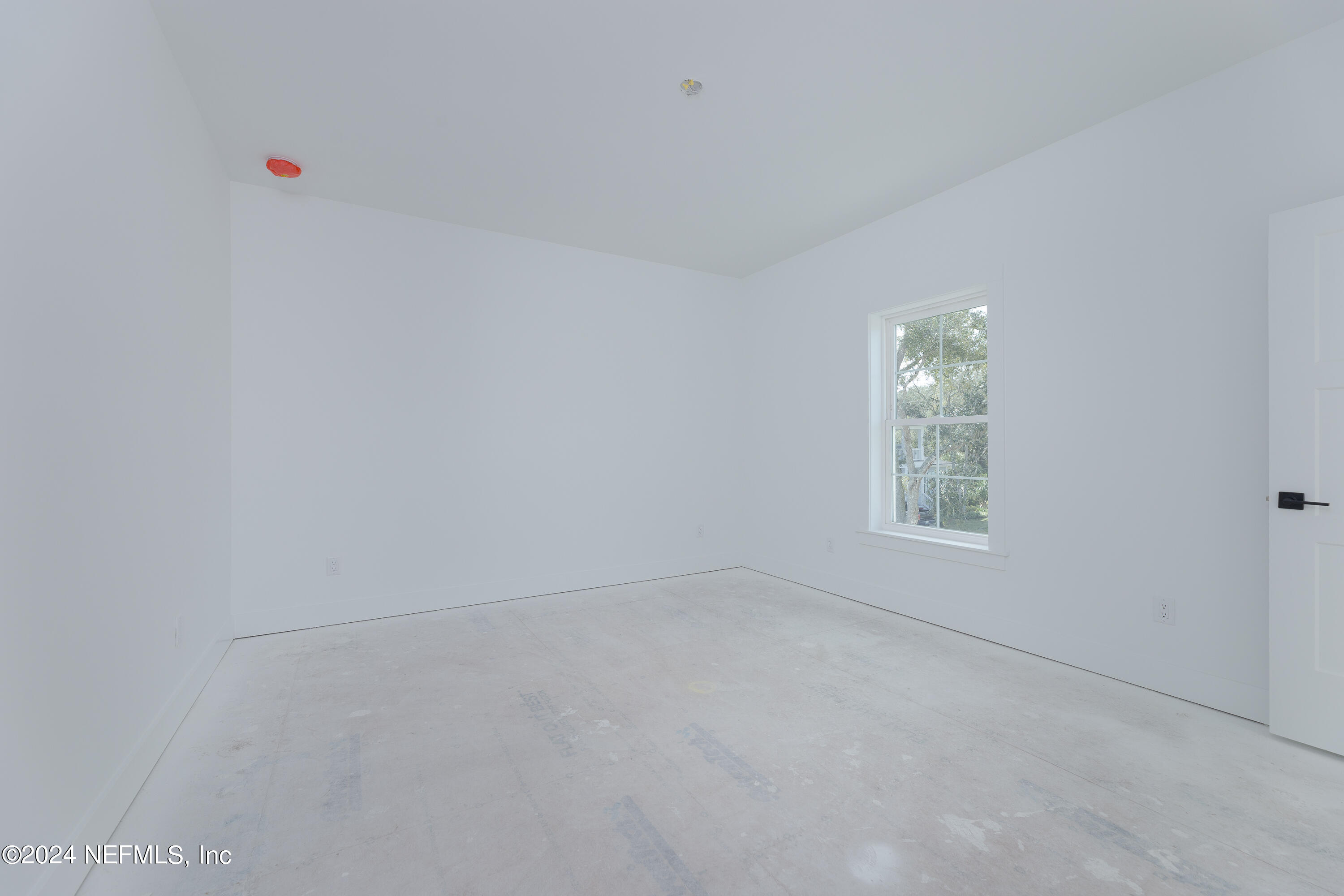 372 Ridgeway Road St. Augustine, FL 32080 - Photo 37 of 38 an empty room with a window