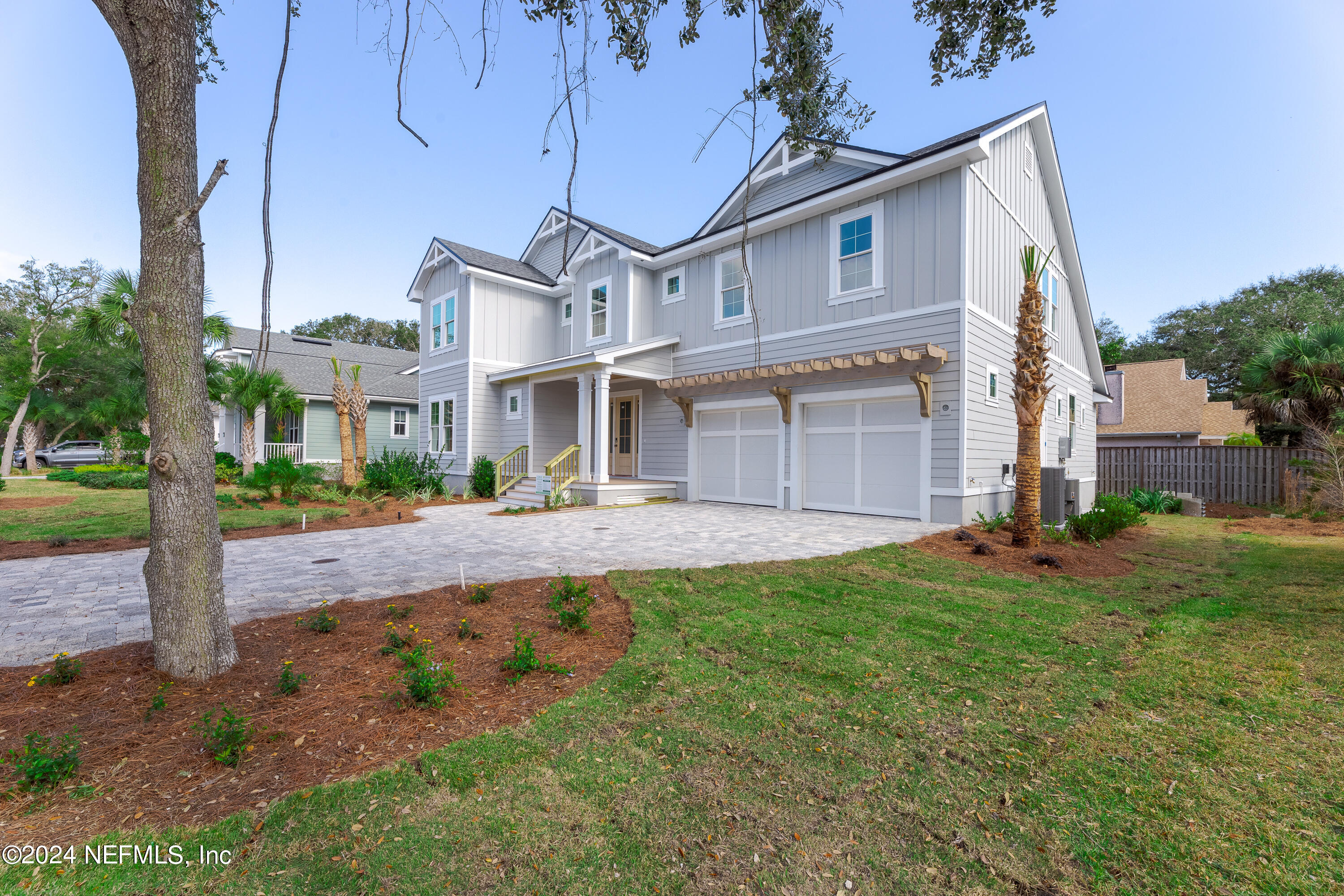 372 Ridgeway Road St. Augustine, FL 32080 - Photo 5 of 38 a front view of a house with a yard and garage