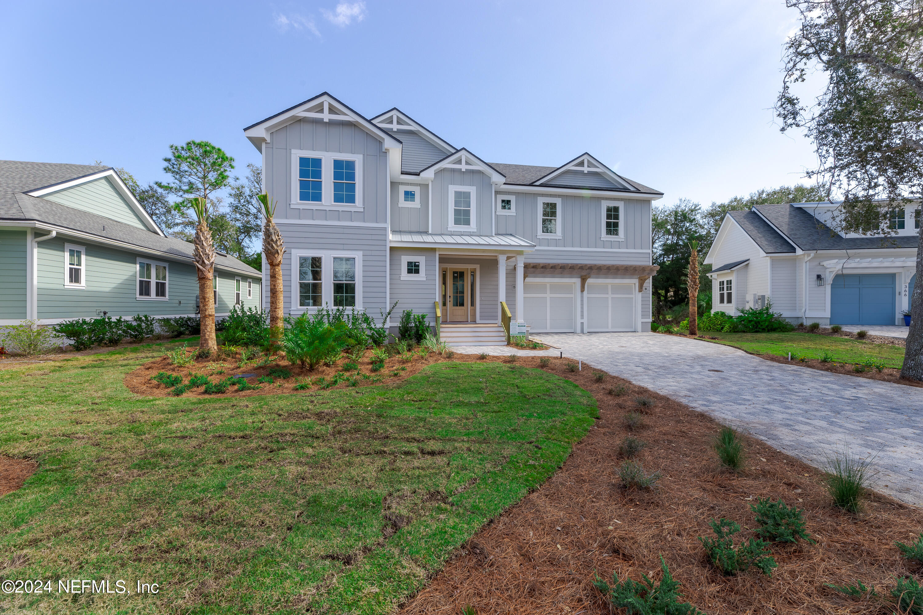 372 Ridgeway Road St. Augustine, FL 32080 - Photo 6 of 38 a front view of a house with a garden and yard
