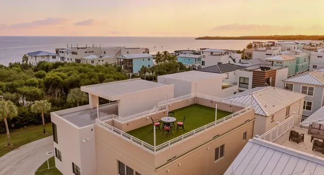 an aerial view of a house with a garden