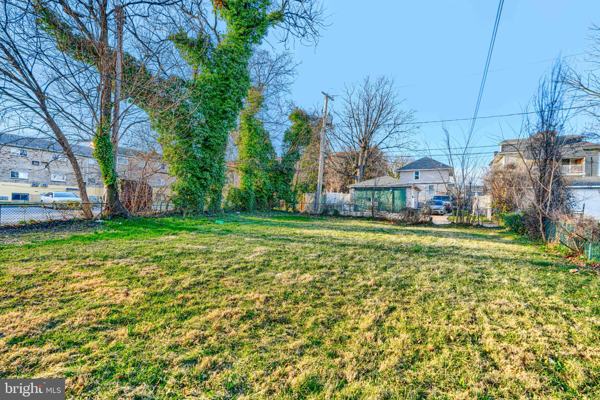 3414 Alto Road, Unit 1 Baltimore, MD 21216 - Photo 17 of 18 Spacious backyard with lush greenery.