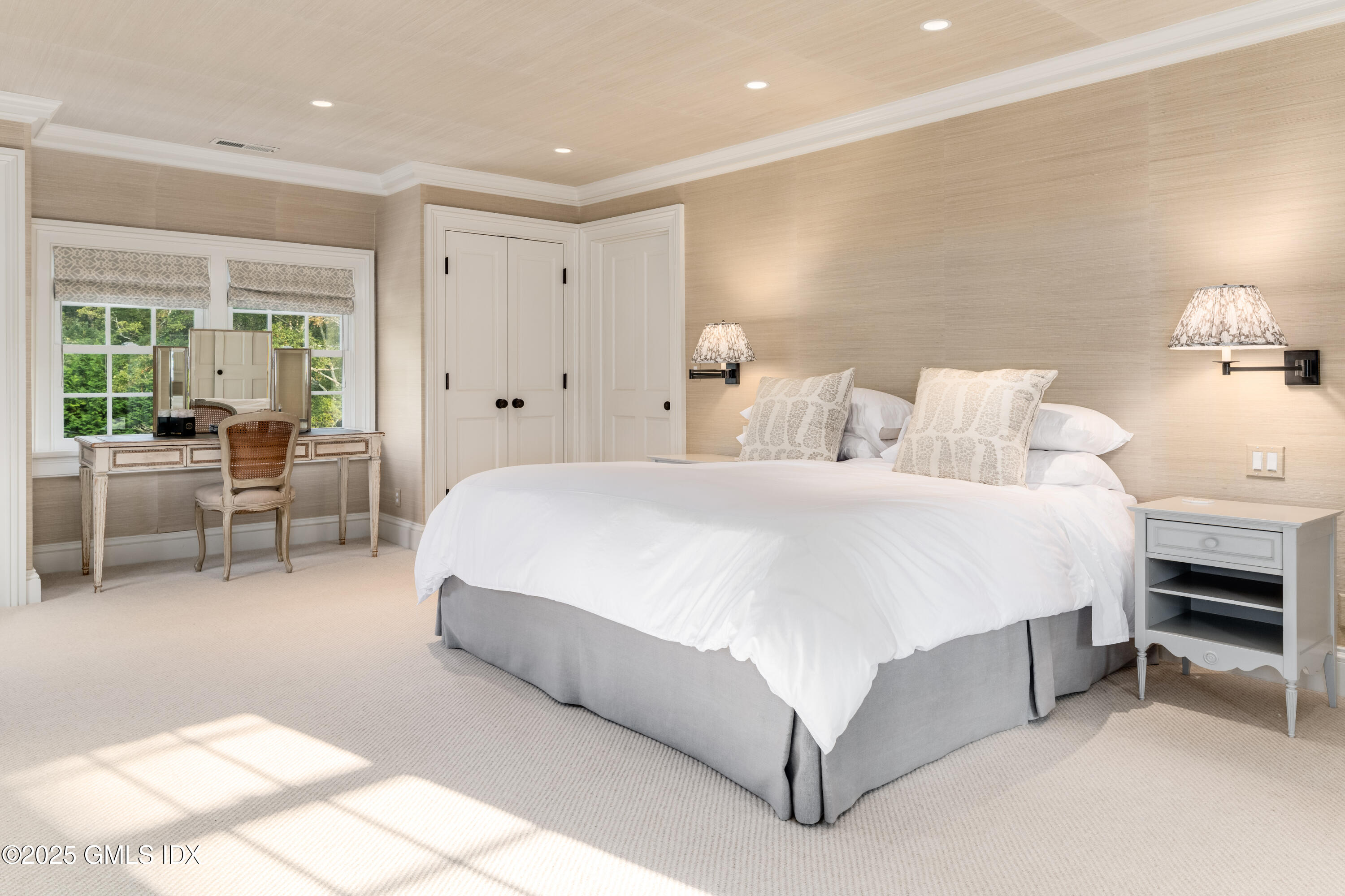 411 Stanwich Road Greenwich, CT 06830 - Photo 18 of 36 a spacious bedroom with a bed and furniture