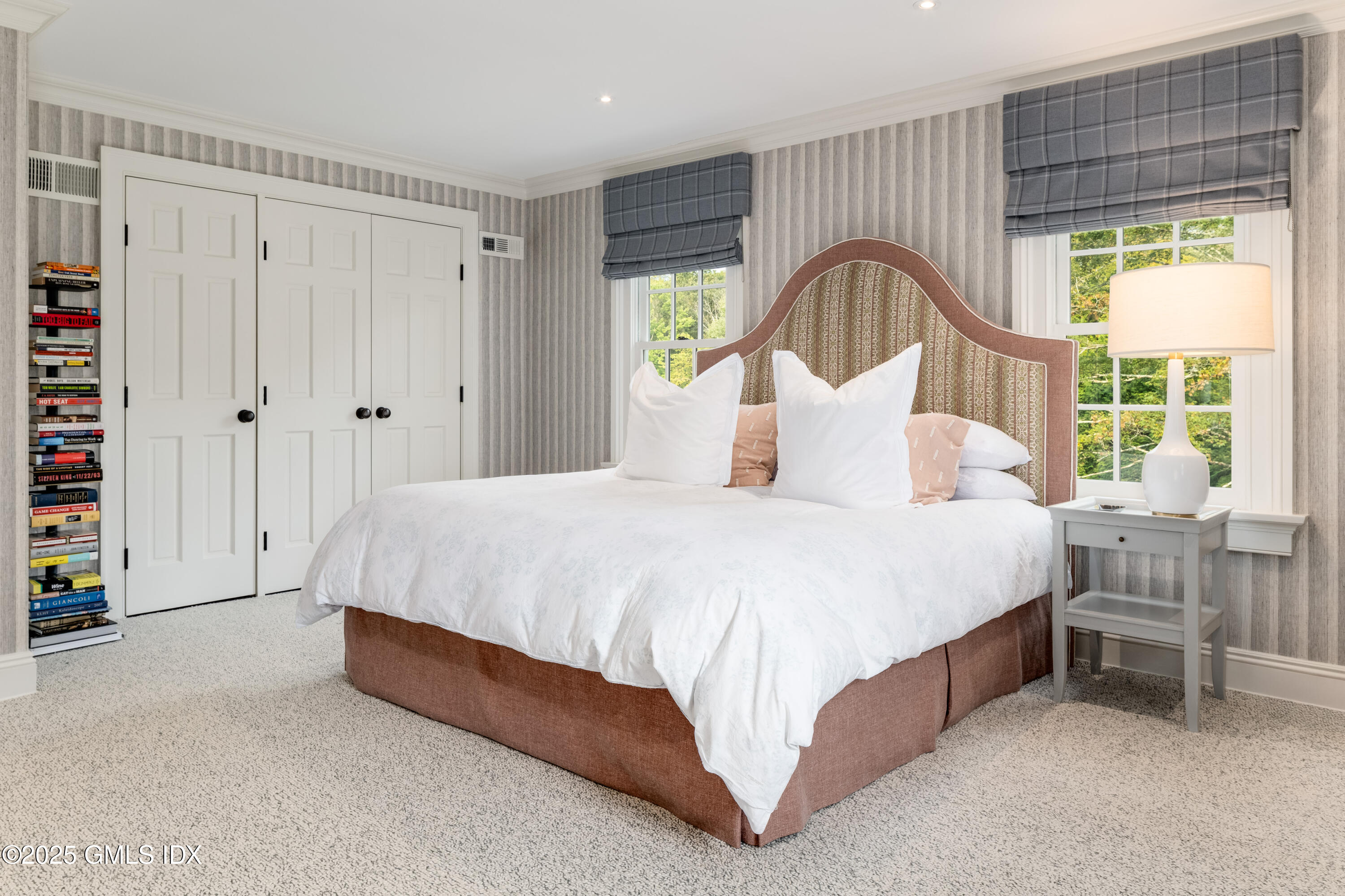 411 Stanwich Road Greenwich, CT 06830 - Photo 25 of 36 a bedroom with a bed and a window