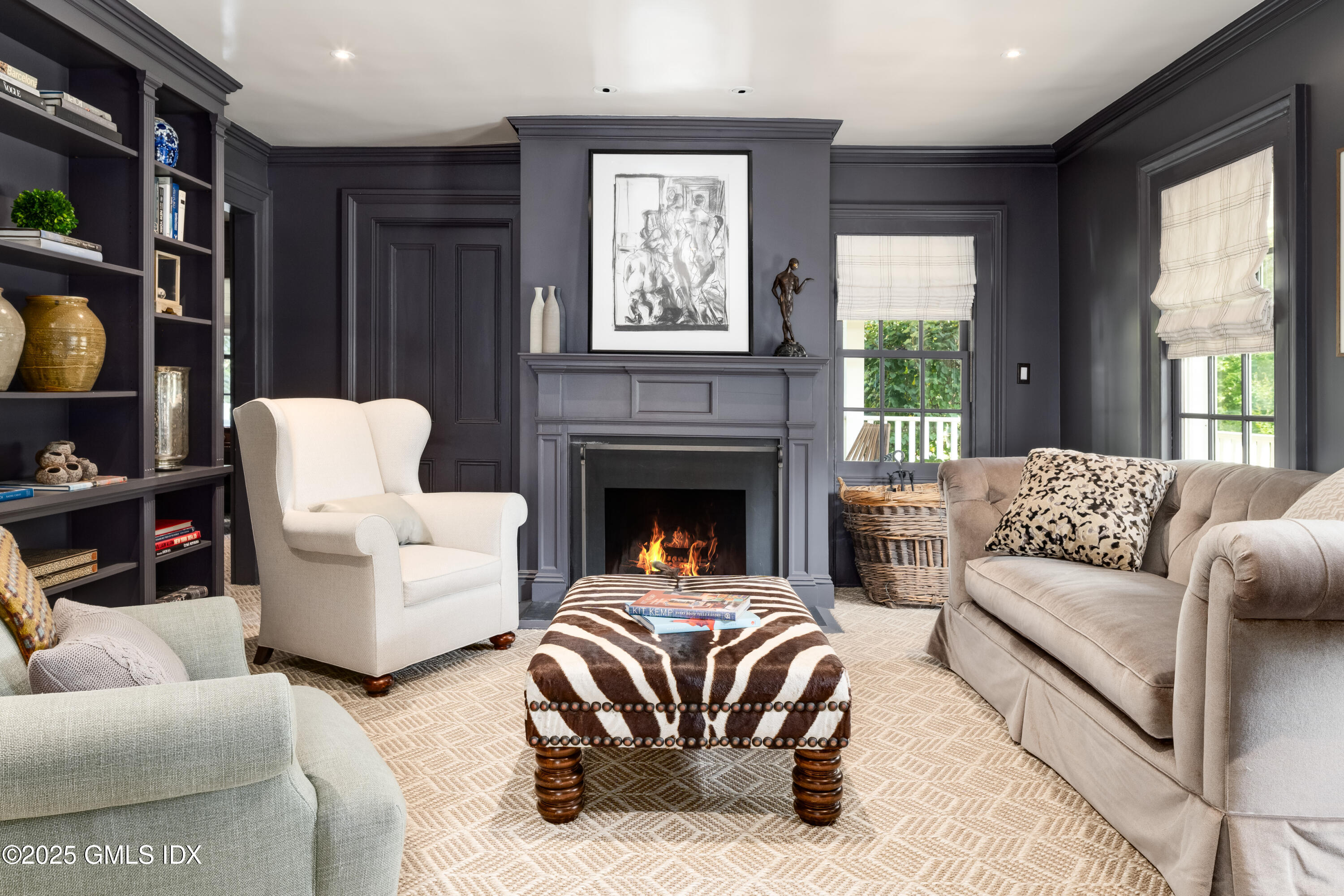 411 Stanwich Road Greenwich, CT 06830 - Photo 9 of 36 a living room with furniture fireplace and a large window
