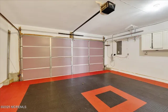 a view of a room with wooden floor and white walls