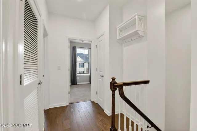 a view of a hallway with washer and dryer