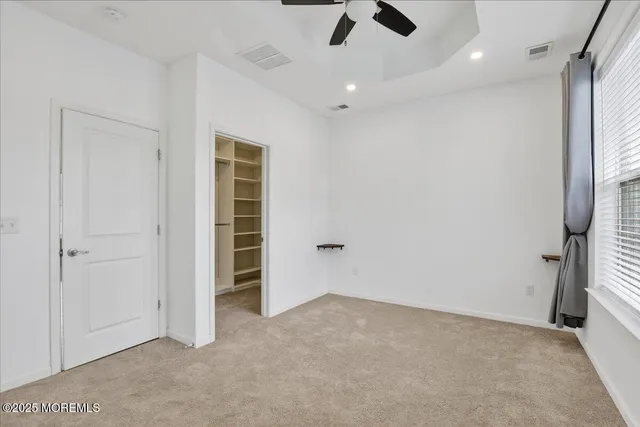 a bathroom with a granite countertop sink a mirror and vanity