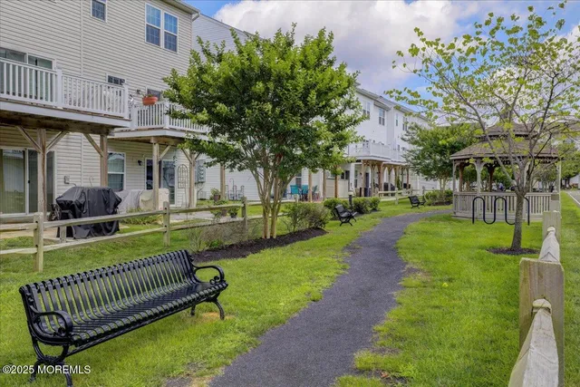 a view of a street with cars and palm trees