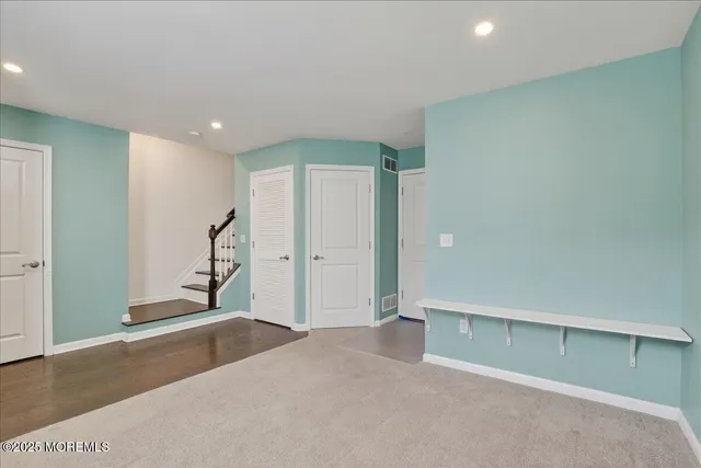 a kitchen with kitchen island a sink stainless steel appliances and cabinets