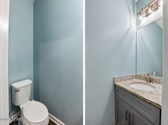a view of kitchen with refrigerator microwave and wooden floor