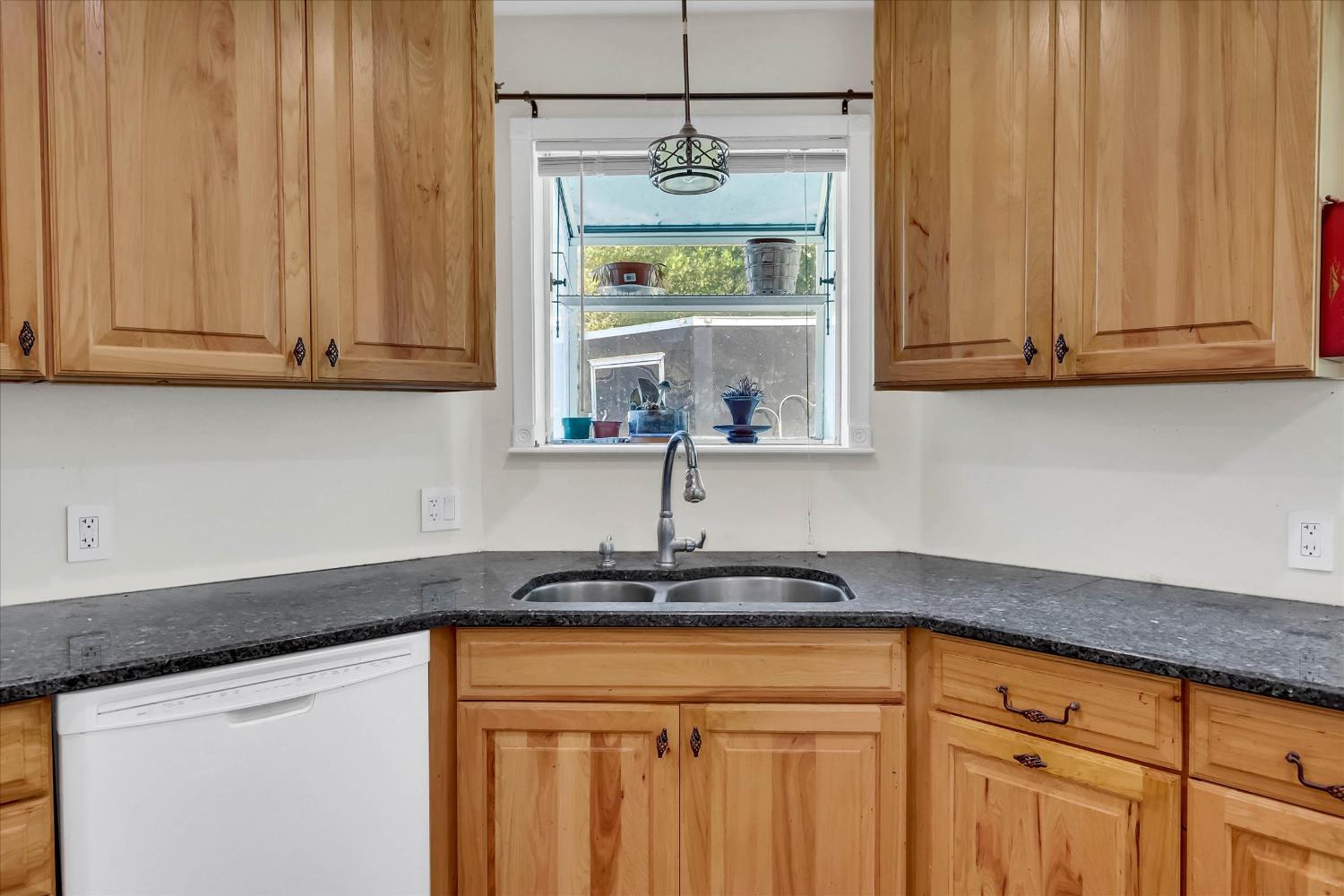 39640 South River Road Clarksburg, CA 95612 - Photo 12 of 25 a kitchen with stainless steel appliances granite countertop a sink a refrigerator and a white cabinets