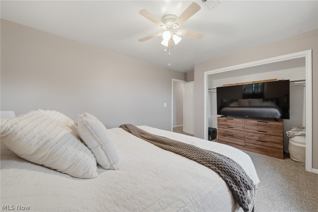 3471 State Rte 5 Newton Falls, OH 44444 - Photo 16 of 31 Carpeted bedroom with neutral wall tones and a ceiling fan with integrated lighting
