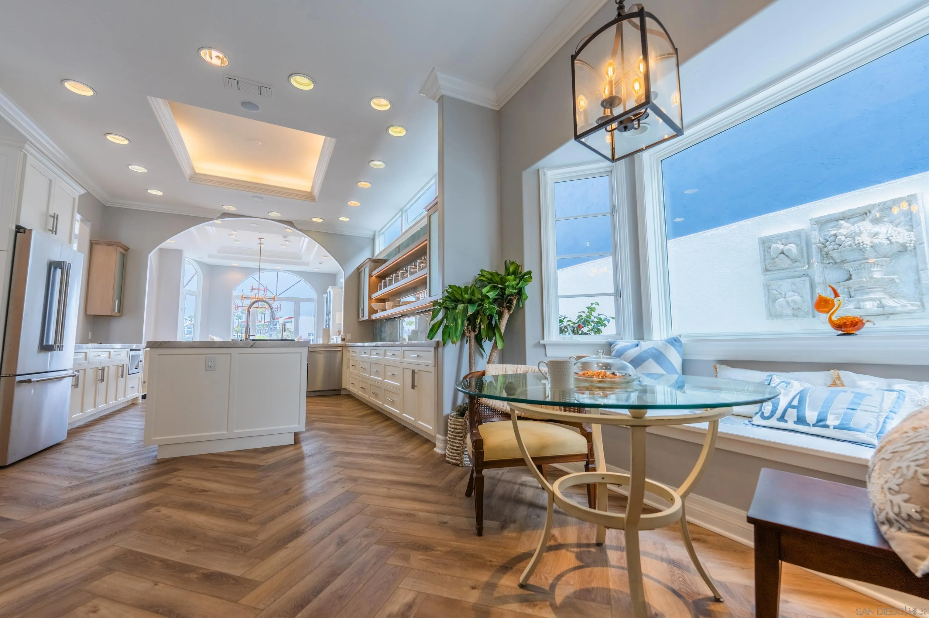 29 The Point Coronado, CA 92118 - Photo 16 of 52 a view of a dining room with furniture and a kitchen