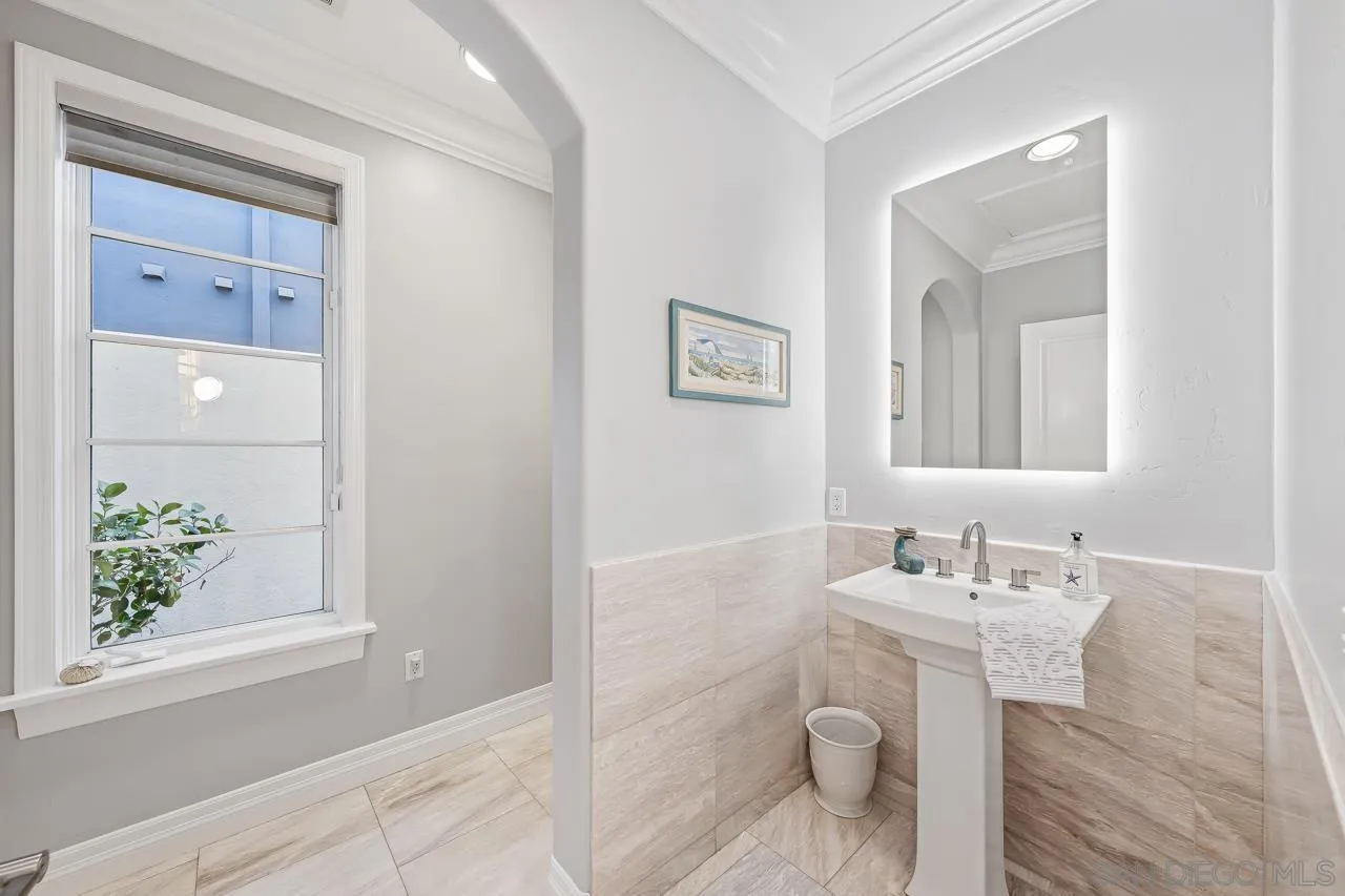 29 The Point Coronado, CA 92118 - Photo 19 of 52 a bathroom with a sink and a mirror