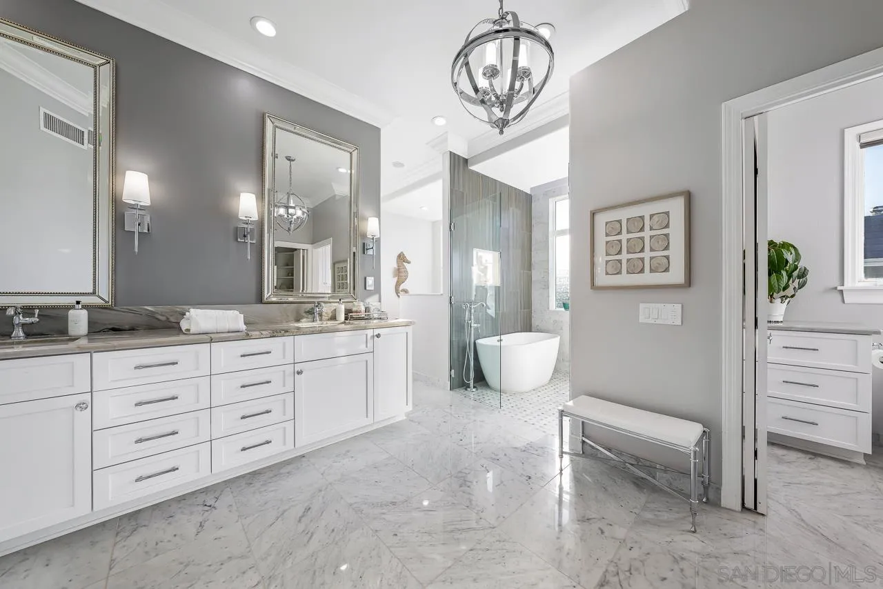 29 The Point Coronado, CA 92118 - Photo 23 of 52 a spacious bathroom with a granite countertop sink a mirror and a bathtub