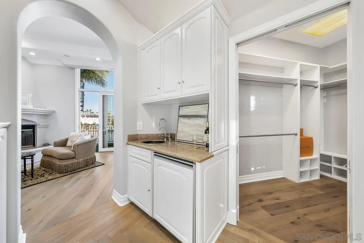 29 The Point Coronado, CA 92118 - Photo 28 of 52 a kitchen with granite countertop a stove a sink and a refrigerator