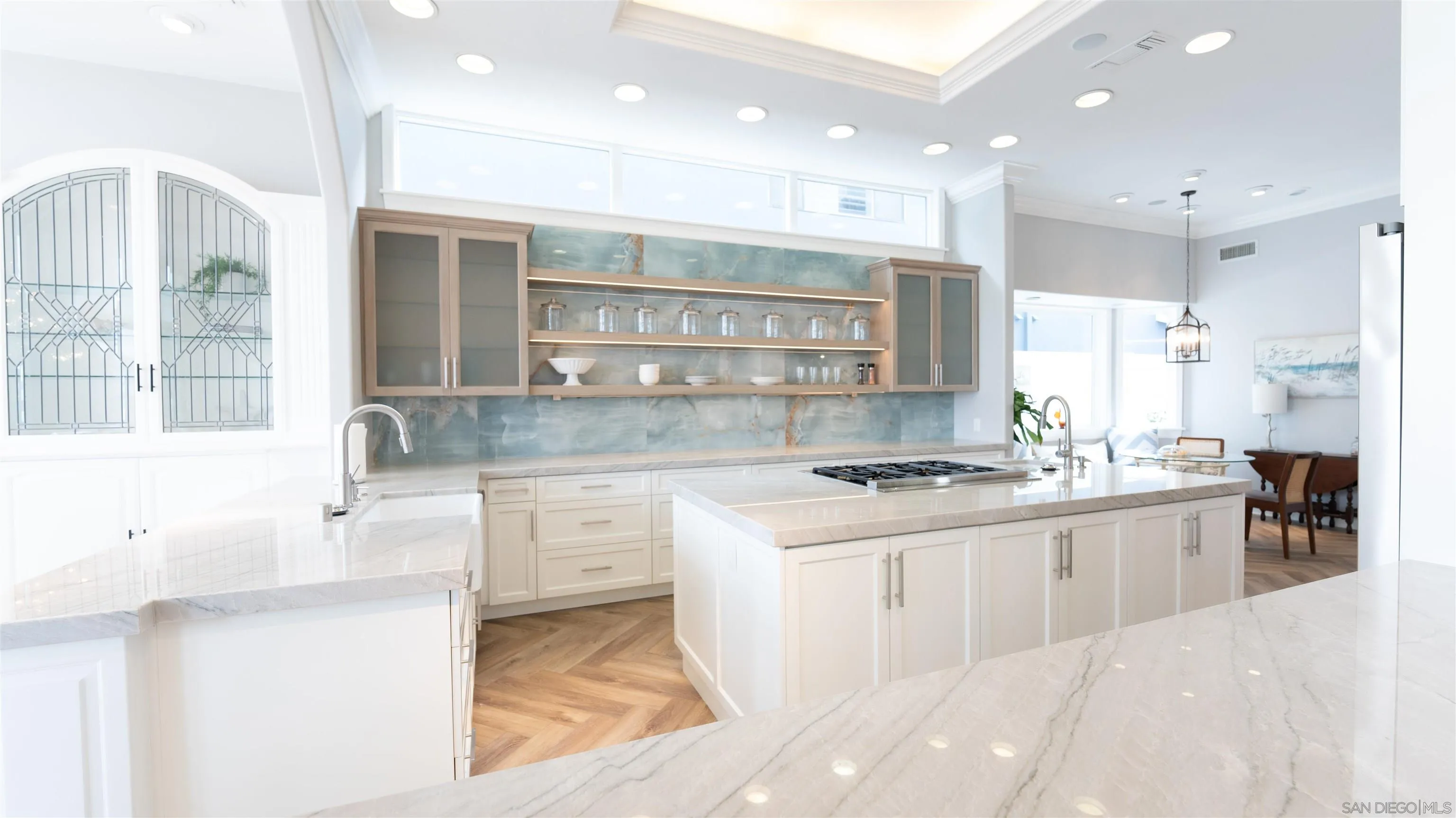 29 The Point Coronado, CA 92118 - Photo 10 of 52 a kitchen with kitchen island a sink stainless steel appliances and cabinets
