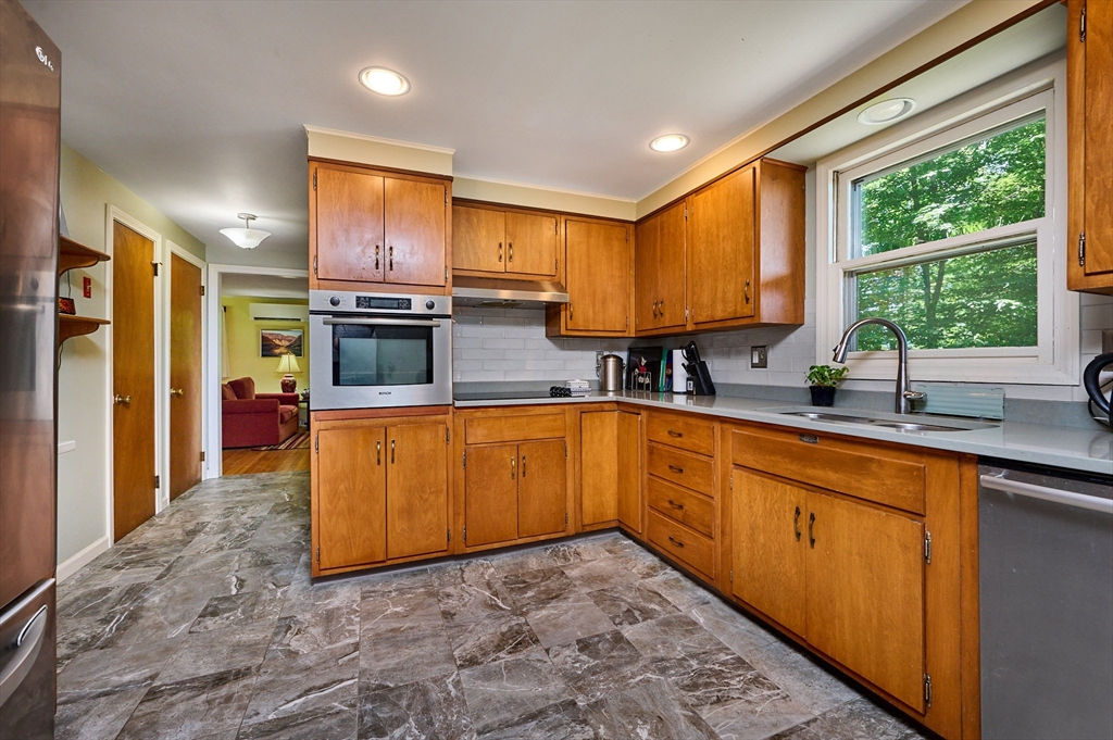 21 Arnold Road Pelham, MA 01002 - Photo 5 of 36 a kitchen with stainless steel appliances granite countertop a stove a sink dishwasher and a refrigerator