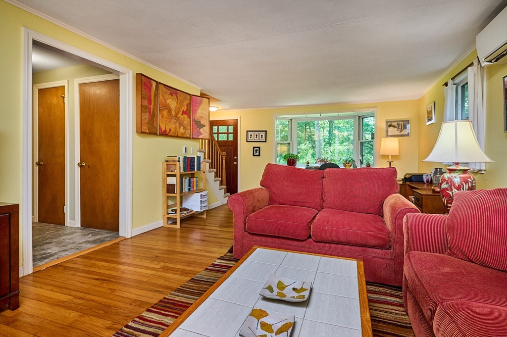 21 Arnold Road Pelham, MA 01002 - Photo 8 of 36 a living room with furniture and a large window