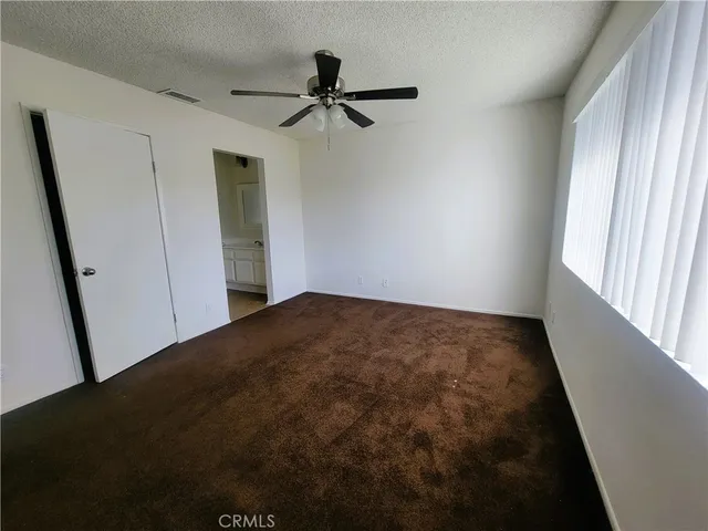 a view of empty room with windows