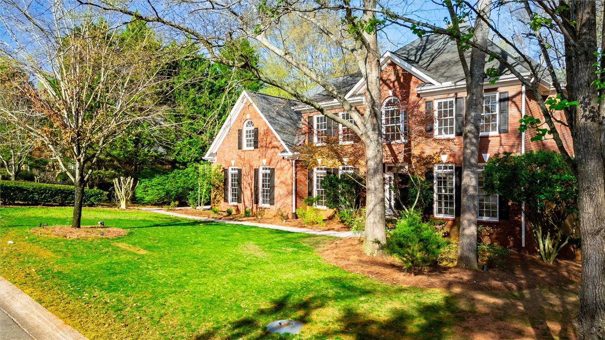 204 Red Maple Way Clemson, SC 29631 - Photo 3 of 48 This classic brick residence features an expansive front yard and traditional architecture.