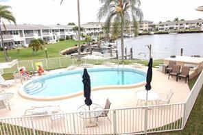 298 Southeast 6th Avenue, Unit 9 Pompano Beach, FL 33060 - Photo 21 of 22 a view of a swimming pool with a lake