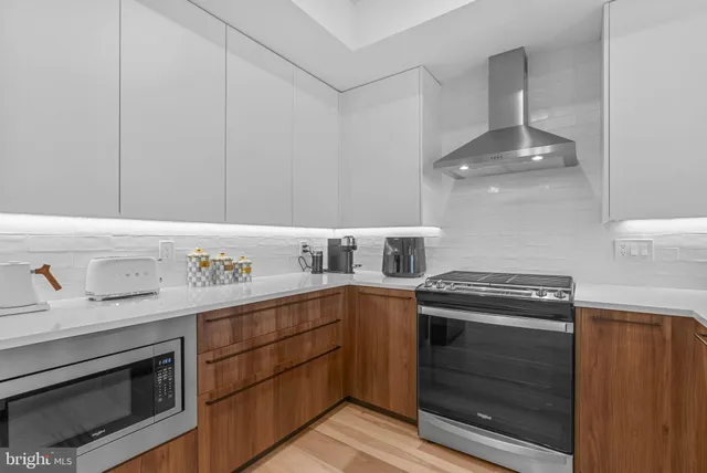 a kitchen with a stove and a sink