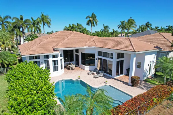 a view of house with yard outdoor seating and entertaining space