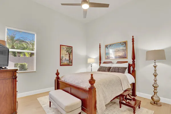 a view of a house with pool and chairs