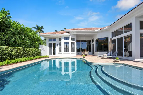 an aerial view of a house with a garden and a yard