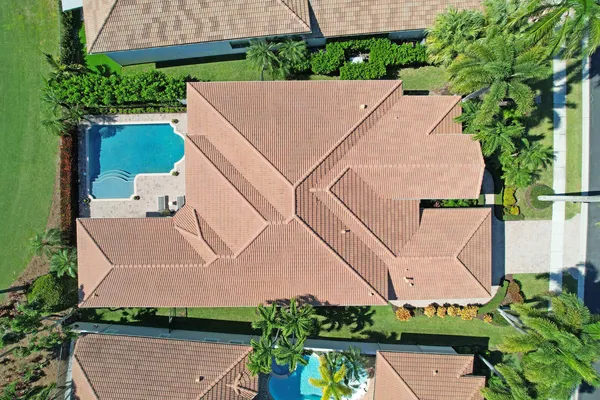 a view of a house with swimming pool and sitting area