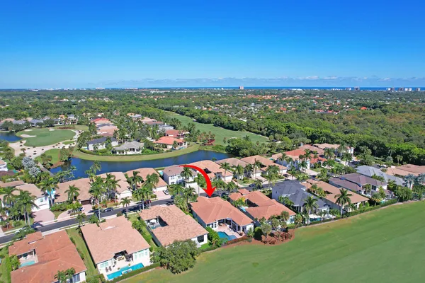 an aerial view of a houses with a yard