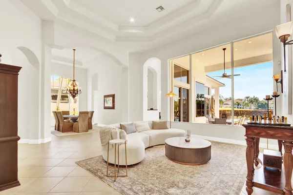 a living room with furniture a table and decor