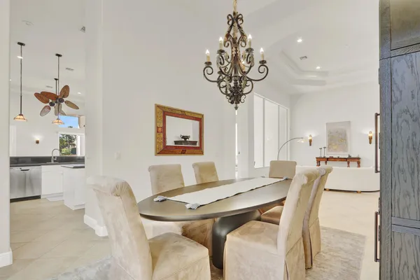 a kitchen with stainless steel appliances granite countertop a sink and a refrigerator