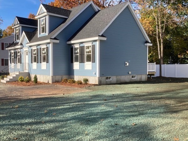 5 7 Oaks Road North Billerica, MA 01862 - Photo 1 of 32 a house with a yard