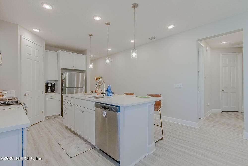3616 Cunningham Road Orange Park, FL 32065 - Photo 13 of 48 a kitchen with stainless steel appliances a sink stove and refrigerator