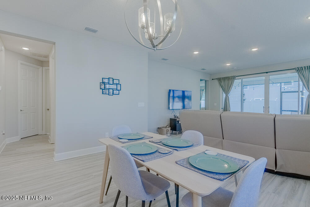 3616 Cunningham Road Orange Park, FL 32065 - Photo 14 of 48 a living room with furniture and a wooden floor