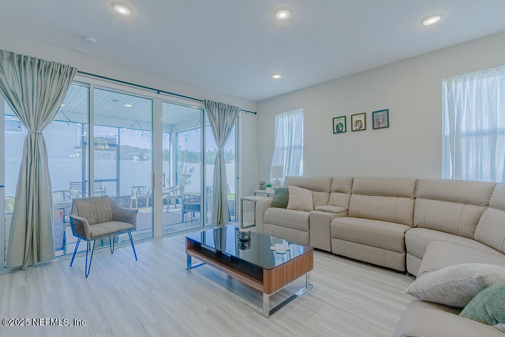 3616 Cunningham Road Orange Park, FL 32065 - Photo 18 of 48 a living room with furniture and a rug