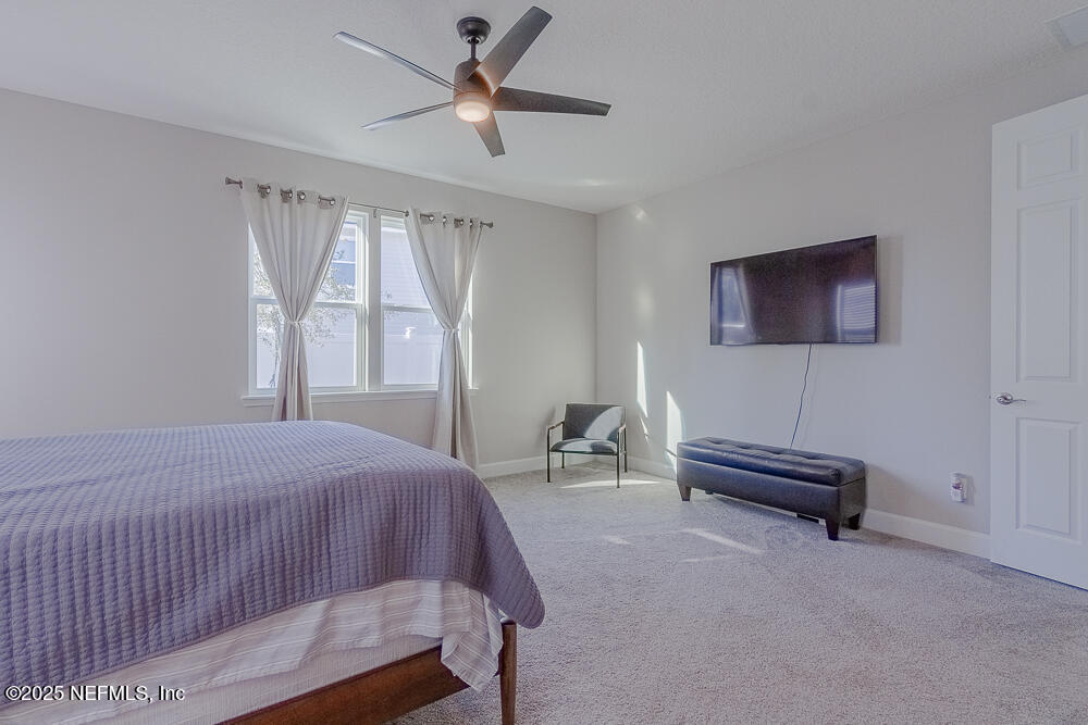 3616 Cunningham Road Orange Park, FL 32065 - Photo 20 of 48 a bedroom with a bed and a window