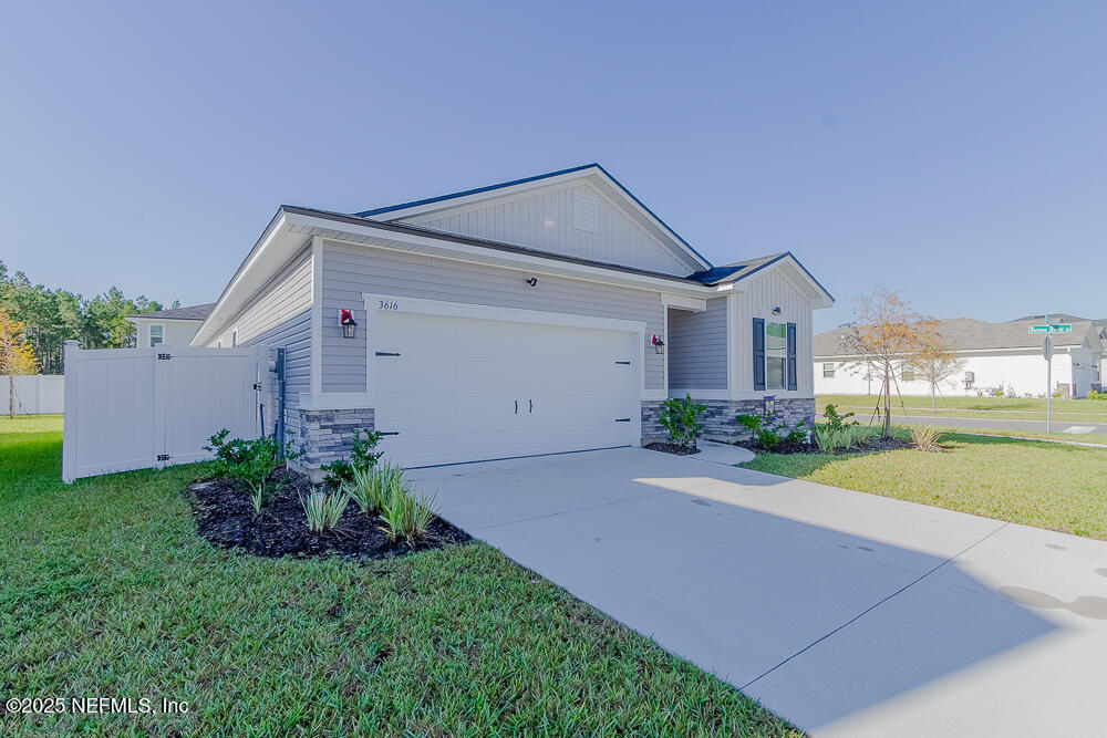 3616 Cunningham Road Orange Park, FL 32065 - Photo 2 of 48 a front view of a house with garden
