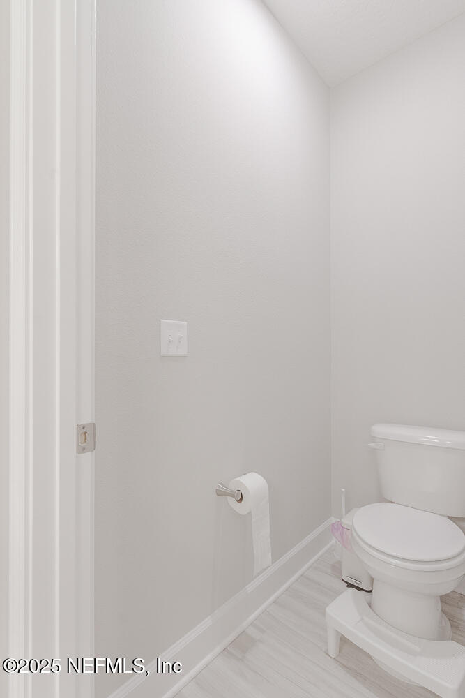 3616 Cunningham Road Orange Park, FL 32065 - Photo 27 of 48 a white toilet sitting next to a shower