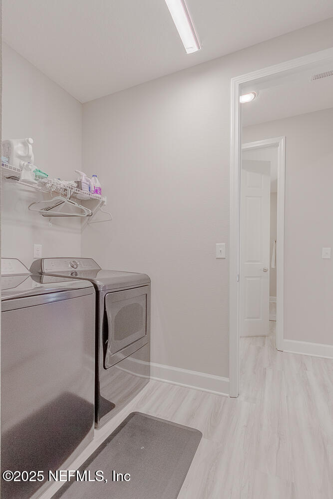 3616 Cunningham Road Orange Park, FL 32065 - Photo 30 of 48 a bathroom with a sink and a mirror