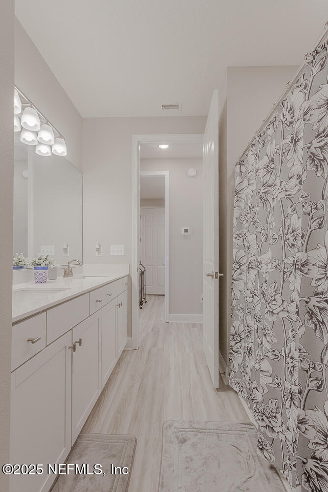 3616 Cunningham Road Orange Park, FL 32065 - Photo 34 of 48 a spacious bathroom with a shower and a sink