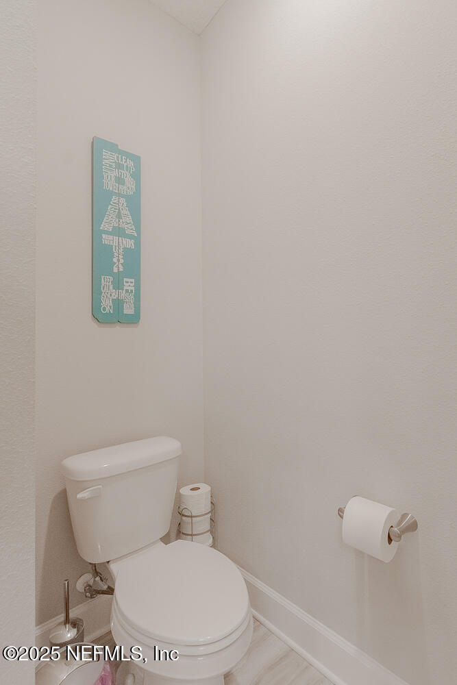 3616 Cunningham Road Orange Park, FL 32065 - Photo 35 of 48 a white toilet sitting next to a white sink