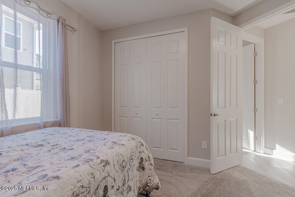 3616 Cunningham Road Orange Park, FL 32065 - Photo 37 of 48 a bedroom with a bed and a window