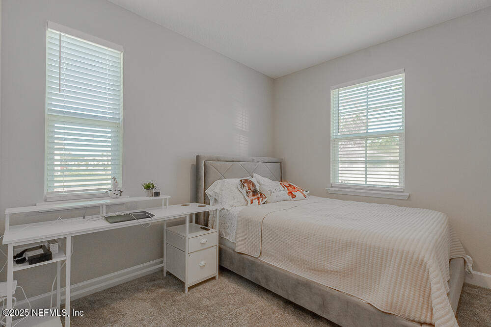 3616 Cunningham Road Orange Park, FL 32065 - Photo 40 of 48 a bedroom with a bed and a window