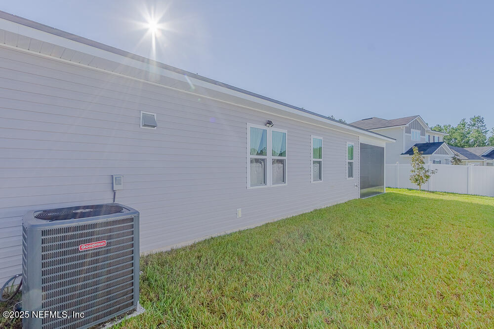 3616 Cunningham Road Orange Park, FL 32065 - Photo 45 of 48 a view of a bedroom with a small yard